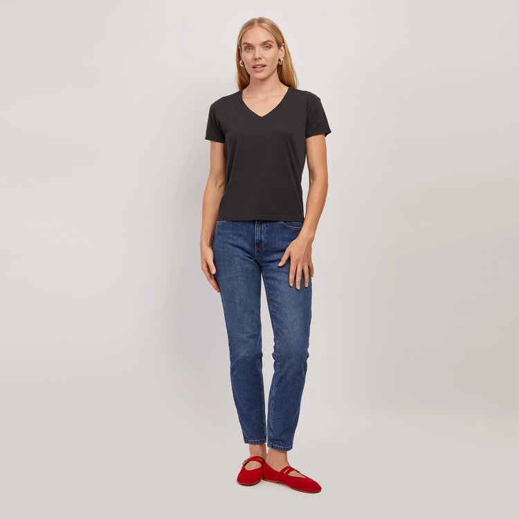 Women wearing Light/Medium Blue High Rise Mom Oliver Jeans