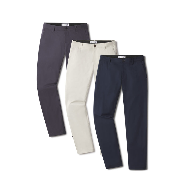 Men wearing Stone/Navy/Granite 5 Pocket Travel Pants 3-Pack pants