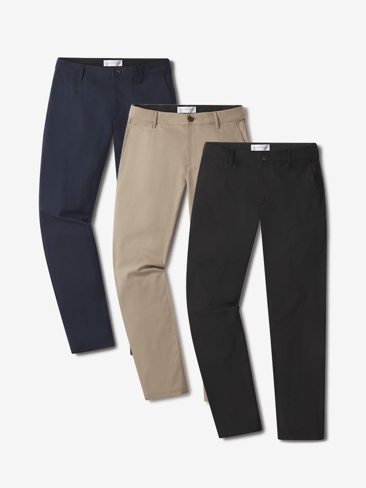  wearing Khaki/Black/Navy Slim Tech Pants 3-Pack