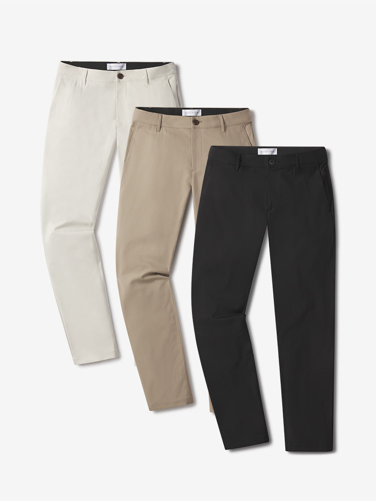  wearing Stone/Khaki/Black Slim Tech Pants 3-Pack pants