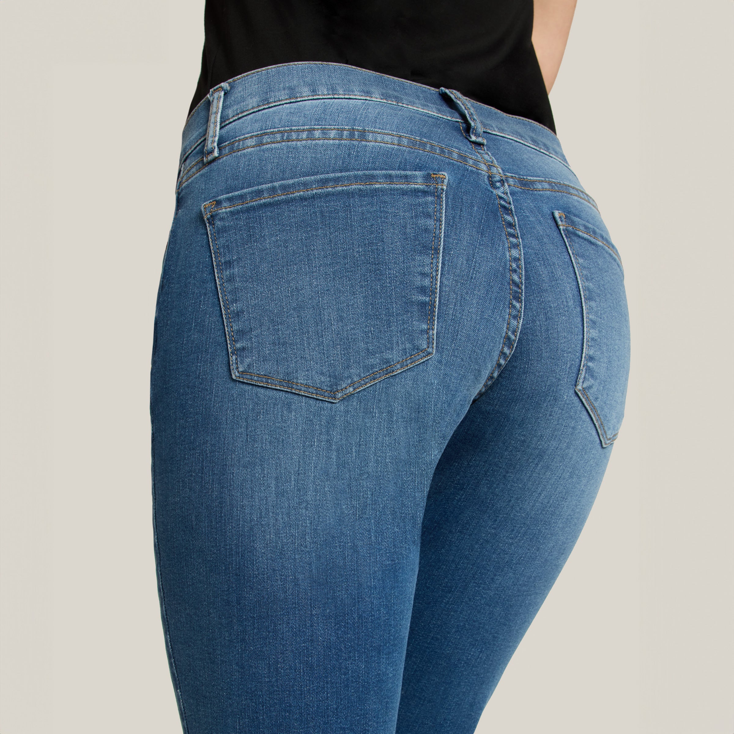 Women wearing Medium Blue Mid Rise Slim Straight Logan Jeans