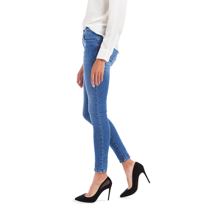 Women wearing Light/Medium Blue Mid Rise Skinny Beekman Jeans
